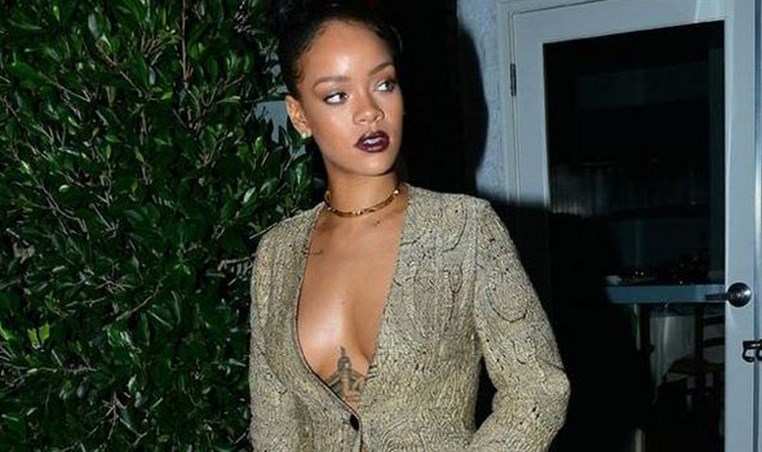 Rihanna exposes her Egyptian goddess tattoo as she goes braless in LA